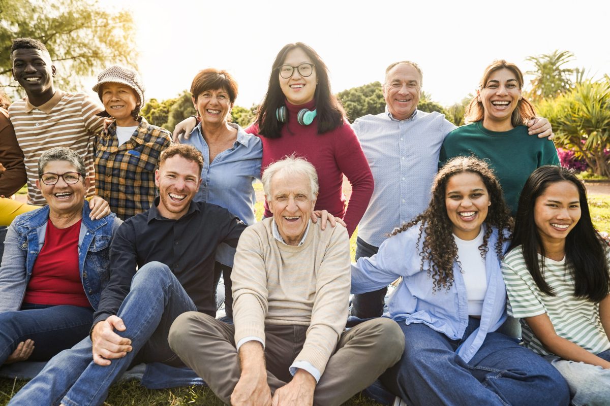 Group of multigenerational people smiling in front of camera - M